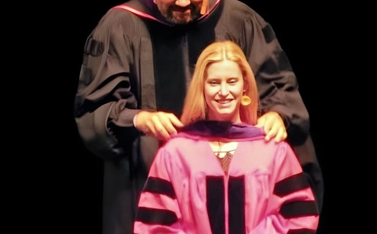 Emma Off being hooded at graduation