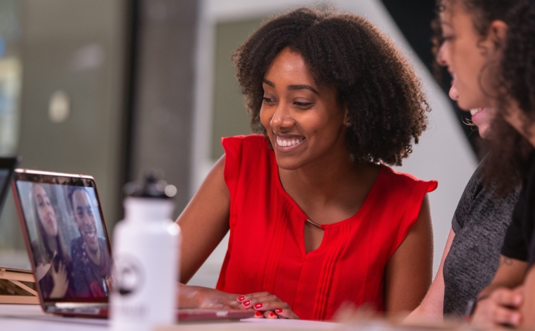 Students work in the newly renovated 1819 Innovation Hub in scenes staged for filming a UC commercial.