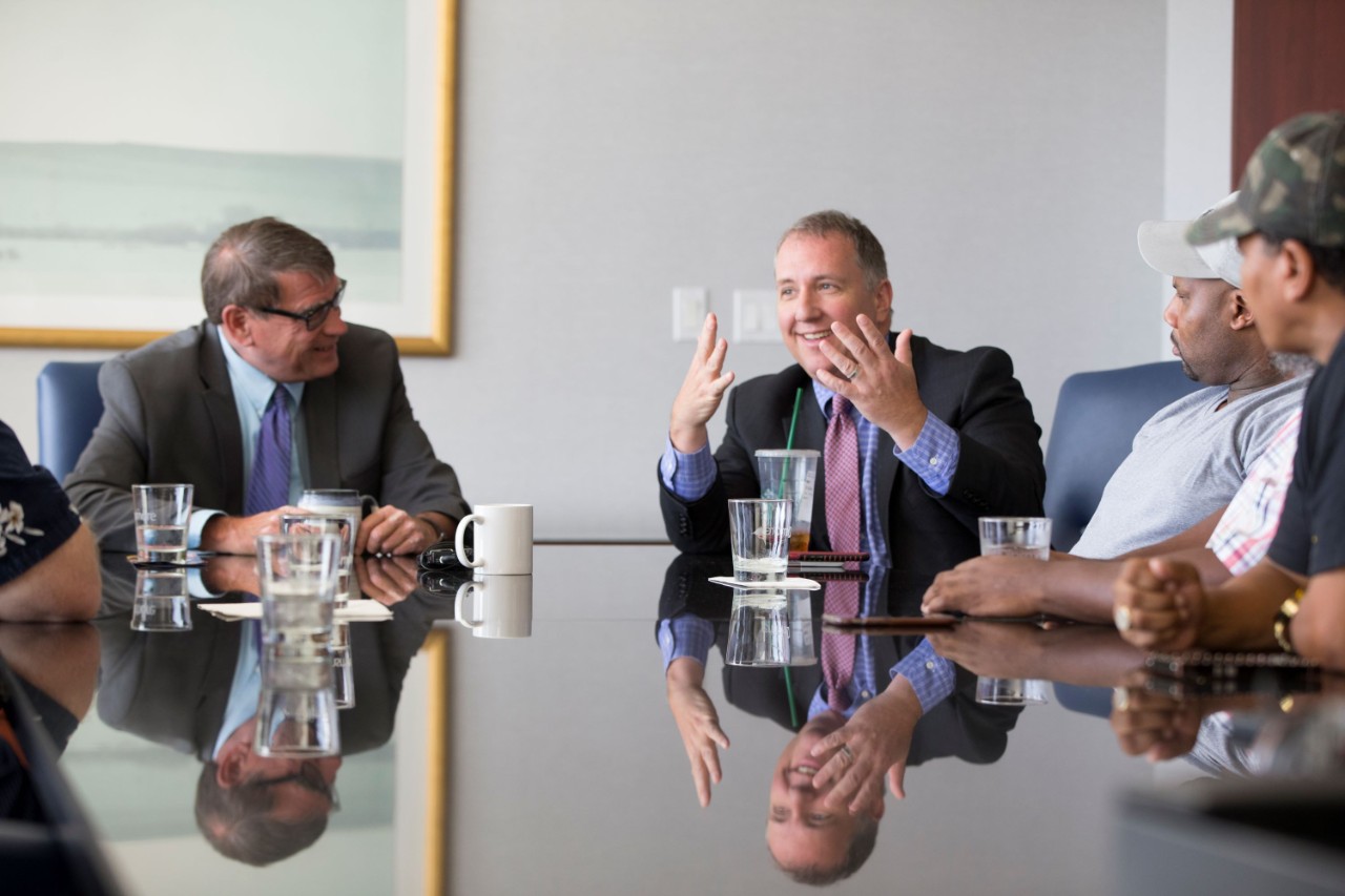 people sitting around a conference table