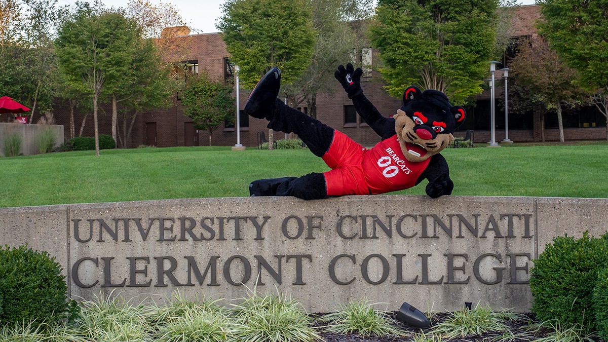 Bearcat poses on top of UC Clermont sign
