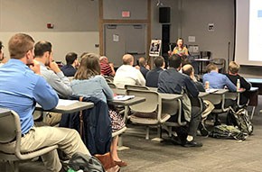 group of nursing alumni in classroom